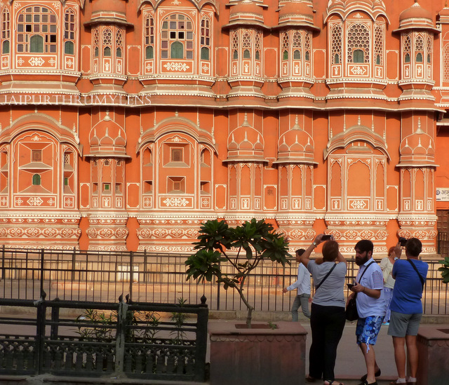tourists capturing picture of hawa mahal jaipur