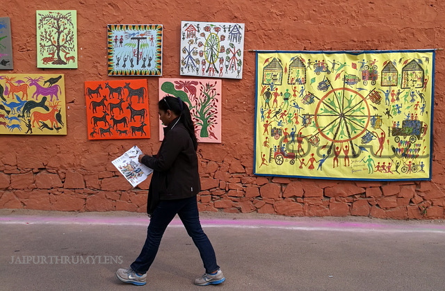 woman-walking-jaipur-literature-festival-hotel-diggi-palace-tribal-painting