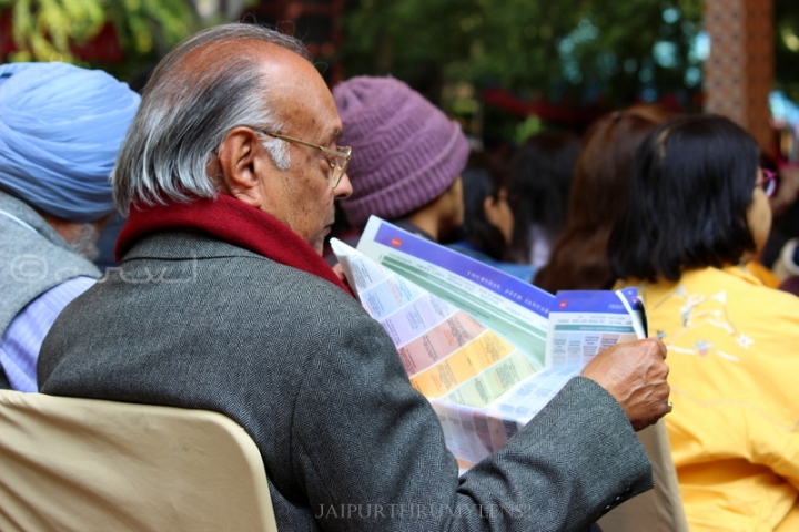old-man-reading-brochure-jaipur-literature-festival