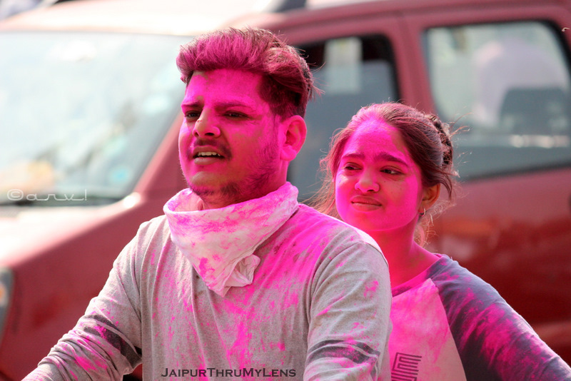 holi-festival-celebration-jaipur-india-couple-on-bike